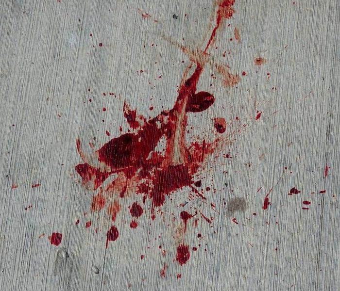 Blood on the ground of a crime scene.